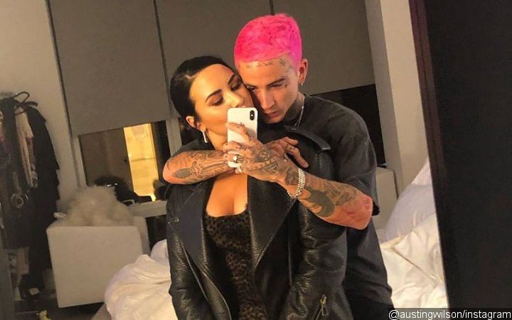 The ‘Heart Attack’ Singer And Her Heavily-Tattooed Beau Take To Their Respective Social Media Account To Share A Picture Of Them Kissing And Embracing Each Other.