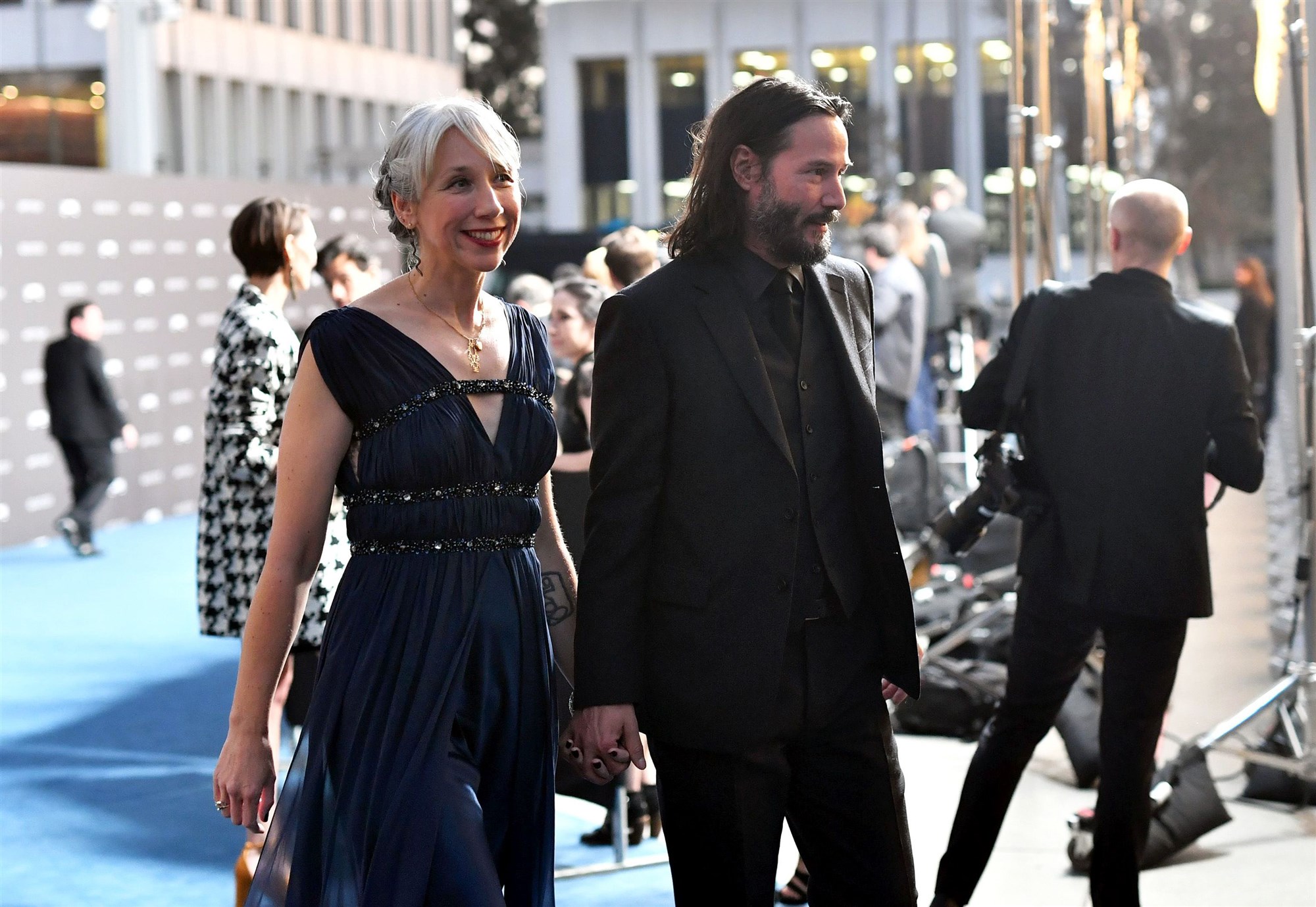Keanu Reeves pictured holding hands with artist Alexandra Grant on the red carpet in LA
