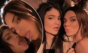 Kylie Jenner and her sister Kylie lark around at a party as they stick their tongues out for the cameras