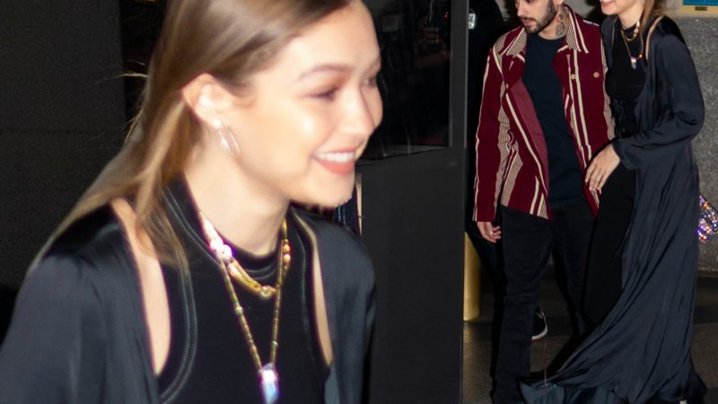 Gigi Hadid couldn’t look happier as she walks arm in arm with Zayn Malik after reuniting with on/off boyfriend on his birthday