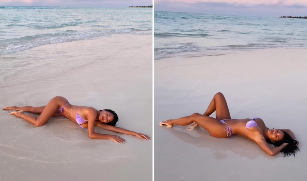 NICOLE Scherzinger rolled around on the beach in a purple bikini, while showing off her toned body.